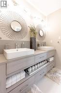 Bathroom with double vanity and a sink - 