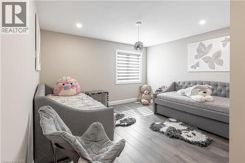 Bedroom featuring wood finished floors, baseboards, and recessed lighting - 477 Blair Creek Drive, Kitchener, ON - Indoor