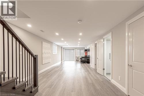 Hallway featuring light wood-style floors, baseboards, stairs, and recessed lighting - 477 Blair Creek Drive, Kitchener, ON - Indoor Photo Showing Other Room
