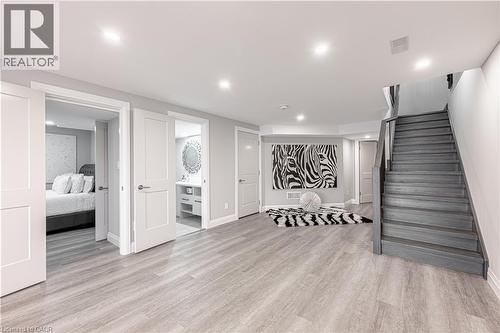 Finished below grade area featuring visible vents, recessed lighting, light wood-style flooring, baseboards, and stairway - 477 Blair Creek Drive, Kitchener, ON - Indoor Photo Showing Other Room