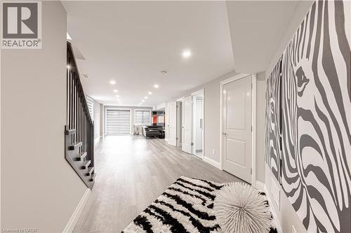 Corridor with stairway, light wood-type flooring, recessed lighting, and baseboards - 477 Blair Creek Drive, Kitchener, ON - Indoor Photo Showing Other Room