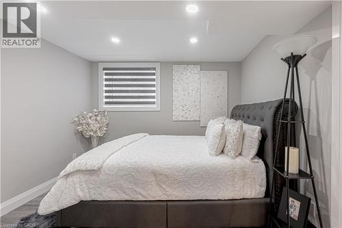 Bedroom featuring baseboards, recessed lighting, and wood finished floors - 477 Blair Creek Drive, Kitchener, ON - Indoor Photo Showing Bedroom