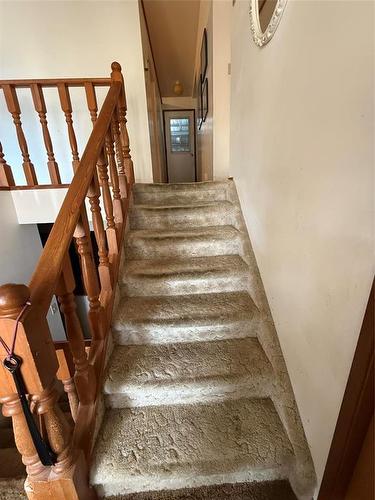 7 steps up (typical bi-level) - 229 Swan River Drive, Swan River, MB - Indoor Photo Showing Other Room