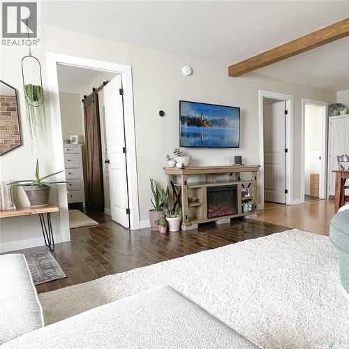 108 Front Street N, Pense, SK - Indoor Photo Showing Living Room With Fireplace