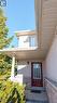 Entrance to property featuring board and batten siding - 85 Bankside Drive Unit# E34, Kitchener, ON  - Outdoor With Exterior 
