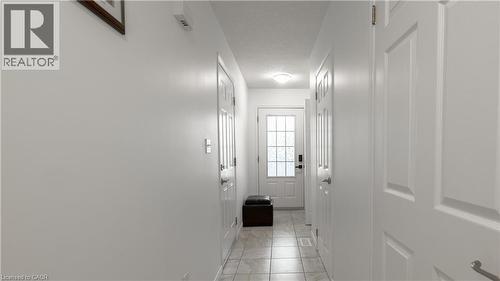 Doorway to outside featuring a textured ceiling - 85 Bankside Drive Unit# E34, Kitchener, ON - Indoor Photo Showing Other Room