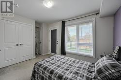 Bedroom 3 with walkout to yard - 