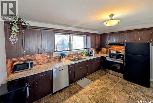 102 Mollard Crescent, Regina, SK - Indoor Photo Showing Kitchen With Double Sink