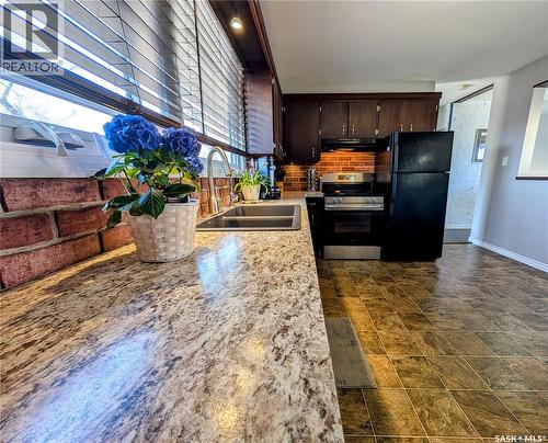 102 Mollard Crescent, Regina, SK - Indoor Photo Showing Kitchen With Double Sink