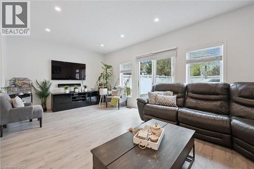 Spacious living area featuring light wood-finish flooring, white walls, and recessed lighting - 11 Patton Drive, Cambridge, ON - Indoor Photo Showing Living Room