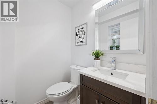 Modern vanity featuring a white rectangular under-mount sink, chrome faucet, and white countertop - 11 Patton Drive, Cambridge, ON - Indoor Photo Showing Bathroom