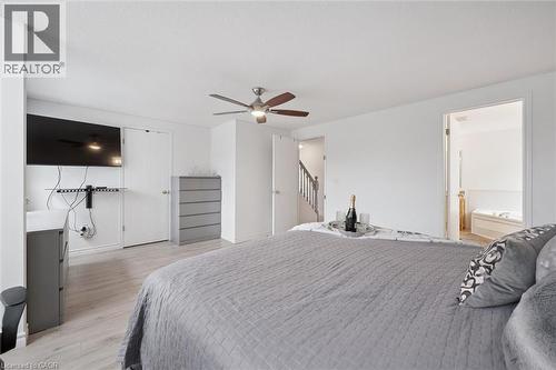 Spacious room featuring light wood-finish flooring and a ceiling fan - 11 Patton Drive, Cambridge, ON - Indoor Photo Showing Bedroom