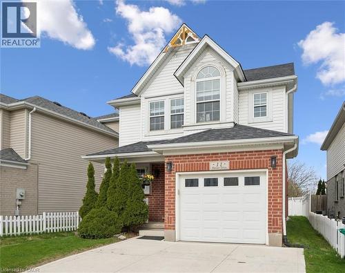Two-story residence featuring a brick and white siding facade with a gabled roofline - 11 Patton Drive, Cambridge, ON - Outdoor