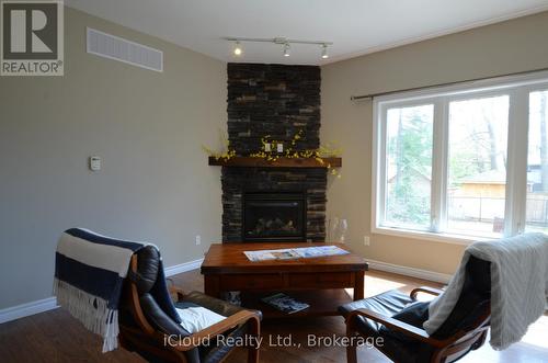 25 Rue Vanier, Tiny, ON - Indoor Photo Showing Living Room With Fireplace