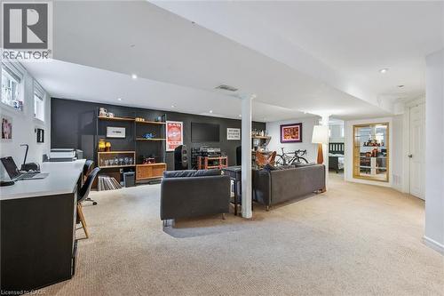 Spacious finished lower level featuring recessed lighting, light-toned carpeting, - 154 Oriole Street, Waterloo, ON - Indoor