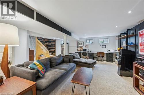 Spacious lower level featuring recessed lighting, light-toned carpeting, - 154 Oriole Street, Waterloo, ON - Indoor Photo Showing Living Room