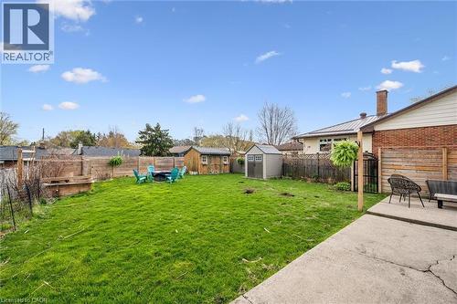 Expansive green lawn with a concrete patio - 154 Oriole Street, Waterloo, ON - Outdoor