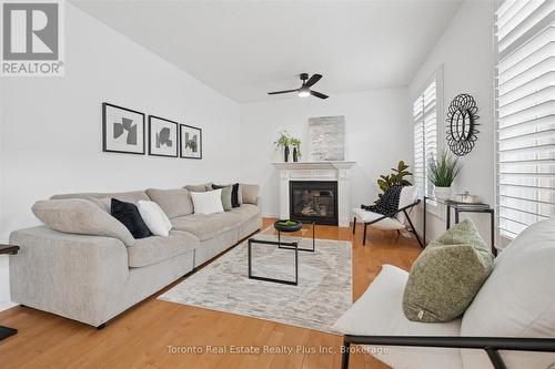 14 Mossgrove Drive, Kitchener, ON - Indoor Photo Showing Living Room With Fireplace