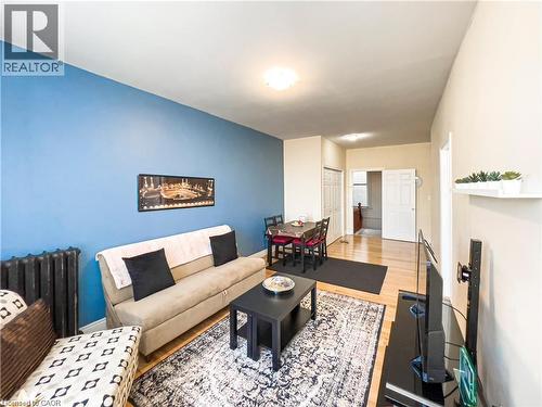 Open concept living area with wood-finish flooring - 85 King Street W, Kitchener, ON 