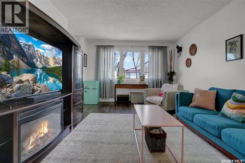 23 Scrivener Crescent, Regina, SK - Indoor Photo Showing Living Room With Fireplace
