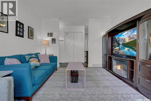23 Scrivener Crescent, Regina, SK - Indoor Photo Showing Living Room With Fireplace