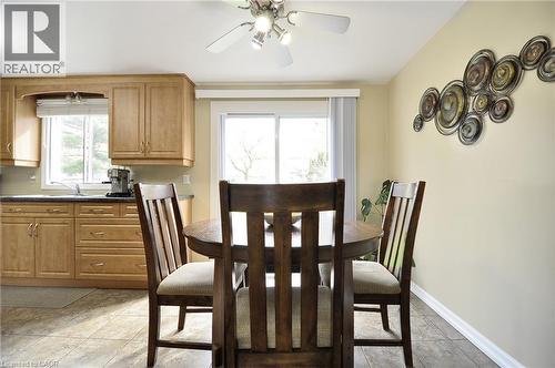 Dining area with tile flooring and a ceiling fan light fixture - 114 Bakersfield Drive, Cambridge, ON - Indoor Photo Showing Dining Room