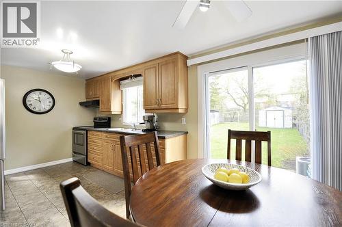 Kitchen dining area with tile flooring and wood-finish cabinetry - 114 Bakersfield Drive, Cambridge, ON - Indoor Photo Showing Dining Room