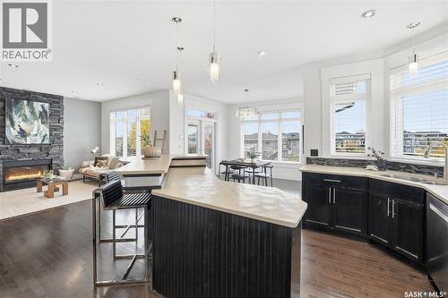 258 Whalley Crescent, Saskatoon, SK - Indoor Photo Showing Kitchen With Fireplace With Double Sink With Upgraded Kitchen