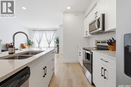 165 Rosewood Boulevard E, Saskatoon, SK - Indoor Photo Showing Kitchen With Double Sink With Upgraded Kitchen
