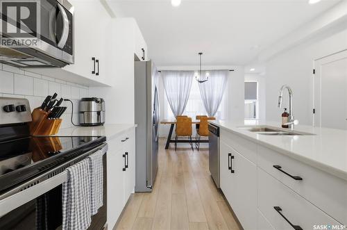 165 Rosewood Boulevard E, Saskatoon, SK - Indoor Photo Showing Kitchen With Double Sink With Upgraded Kitchen