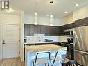 985 Academy Way Unit# 310, Kelowna, BC  - Indoor Photo Showing Kitchen With Upgraded Kitchen 