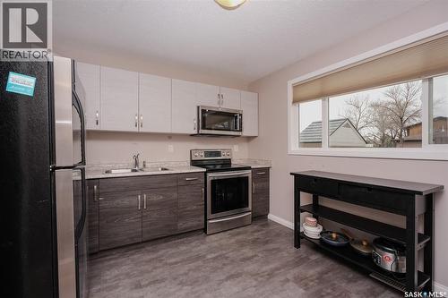 91 Mackenzie Way, Regina, SK - Indoor Photo Showing Kitchen With Stainless Steel Kitchen With Double Sink
