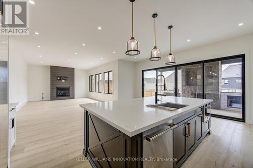 8 Edgeview Crescent W, Middlesex Centre, ON - Indoor Photo Showing Kitchen With Fireplace With Upgraded Kitchen