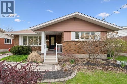Brick and siding exterior featuring a covered porch entry - 111 Ruskview Road, Kitchener, ON - Outdoor