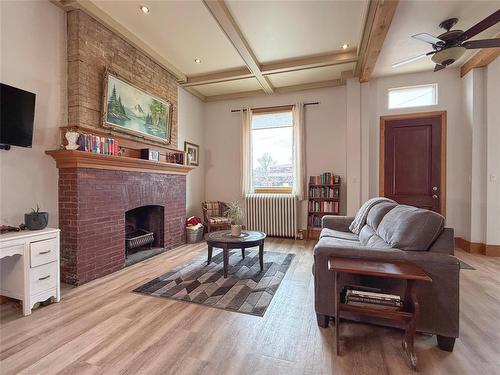 141 Main Street, Rivers, MB - Indoor Photo Showing Living Room With Fireplace