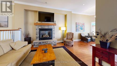 9-8 - 532 10Th Concession Road, Westport, ON - Indoor Photo Showing Living Room With Fireplace