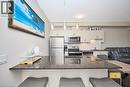 16 Concord Place Unit# 803, Grimsby, ON  - Indoor Photo Showing Kitchen With Upgraded Kitchen 