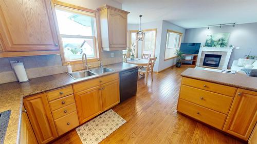 1308 20A Street, Cranbrook, BC - Indoor Photo Showing Kitchen With Fireplace With Double Sink