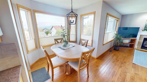 1308 20A Street, Cranbrook, BC - Indoor Photo Showing Dining Room With Fireplace