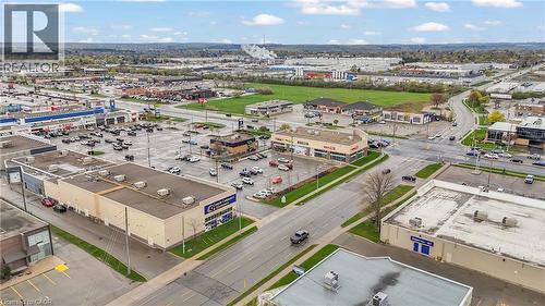 Commercial building with extensive parking lot, situated at a prominent intersection - 545 Hespeler Road, Cambridge, ON 