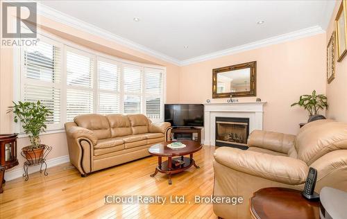 625 Laughren Crescent, Milton, ON - Indoor Photo Showing Living Room With Fireplace