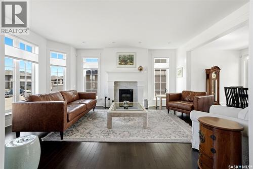 6105 Little Pine Loop, Regina, SK - Indoor Photo Showing Living Room With Fireplace