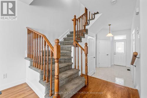 Staircase with wood railings - 988 Lucille Way, Ottawa, ON - Indoor Photo Showing Other Room