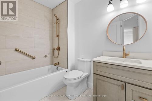 Bathroom with tub and gold fixtures - 988 Lucille Way, Ottawa, ON - Indoor Photo Showing Bathroom