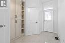 Foyer with custom storage and powder room - 988 Lucille Way, Ottawa, ON  - Indoor Photo Showing Other Room 