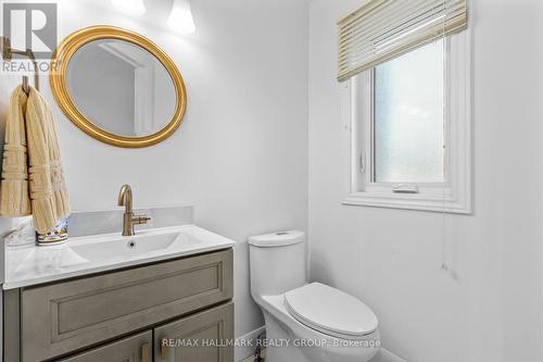 Modern powder room with gold accents - 988 Lucille Way, Ottawa, ON - Indoor Photo Showing Bathroom