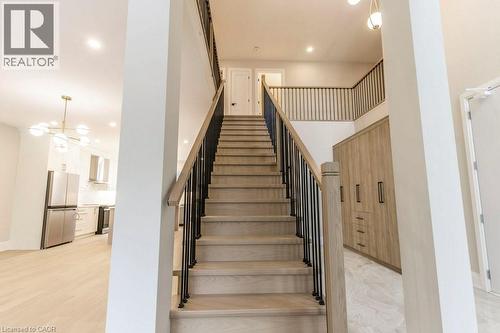 Stairs featuring hanging lights - 1105 Main Street E, Cambridge, ON - Indoor Photo Showing Other Room