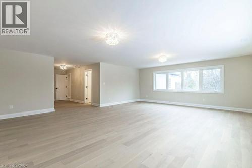 Empty room featuring baseboards and light wood-style flooring - 1105 Main Street E, Cambridge, ON - Indoor Photo Showing Other Room