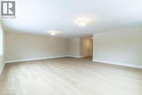Spare room featuring baseboards and light wood-style flooring - 1105 Main Street E, Cambridge, ON - Indoor Photo Showing Other Room