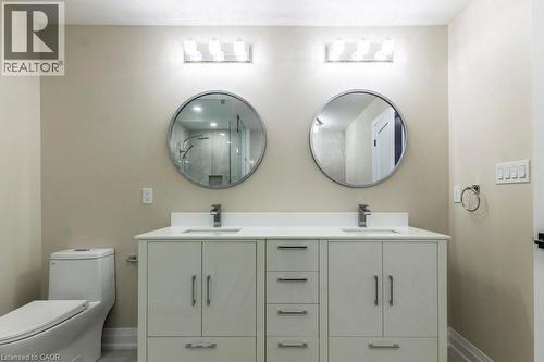 Full bathroom featuring double vanity and a marble finish shower - 1105 Main Street E, Cambridge, ON - Indoor Photo Showing Bathroom